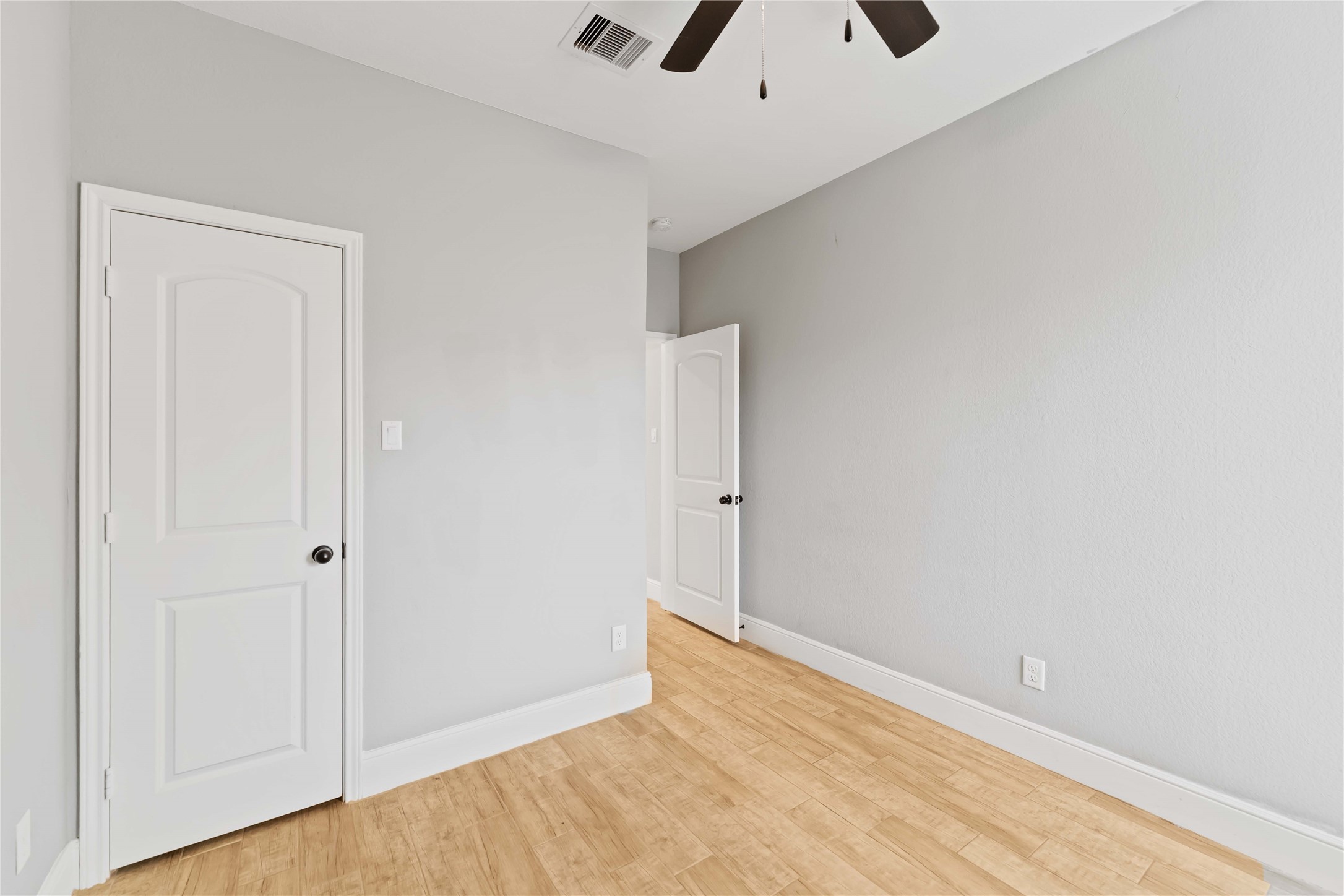 4651 Mallow Street, Unit AB Houston, TX 77051 - Photo 12 of 20 an empty room with fan and entrance