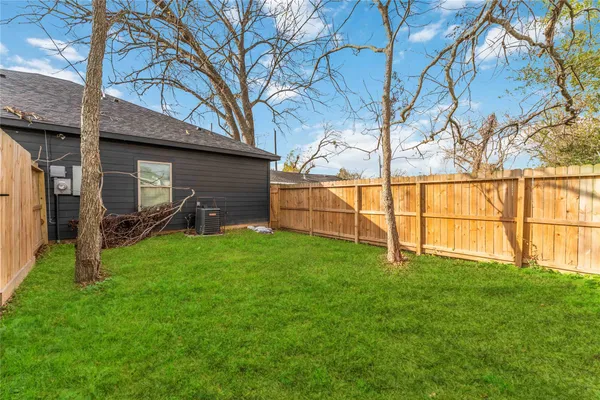 a backyard of a house with lots of green space