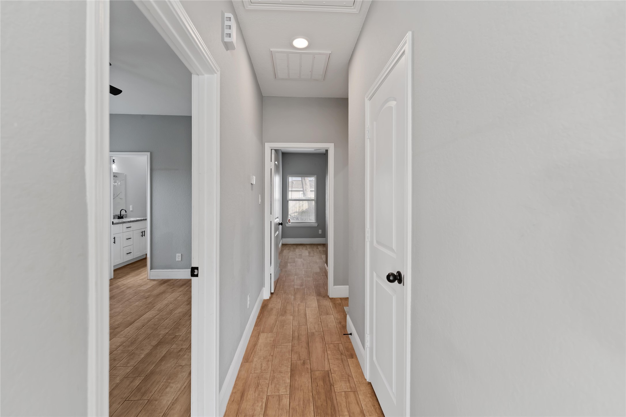 4651 Mallow Street, Unit AB Houston, TX 77051 - Photo 10 of 20 a view of a hallway with wooden floor