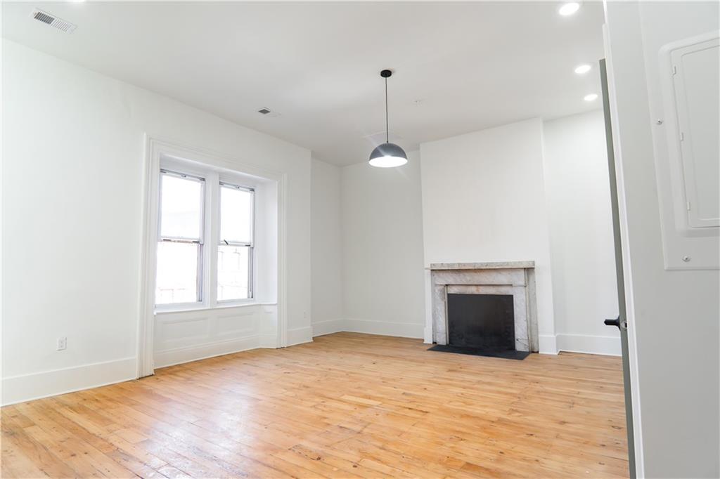 4402 Butler Street Pittsburgh, PA 15201 - Photo 14 of 28 a view of empty room with window and fireplace