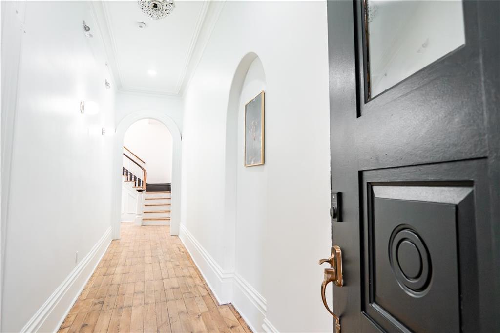 4402 Butler Street Pittsburgh, PA 15201 - Photo 2 of 28 a view of a hallway with wooden floor