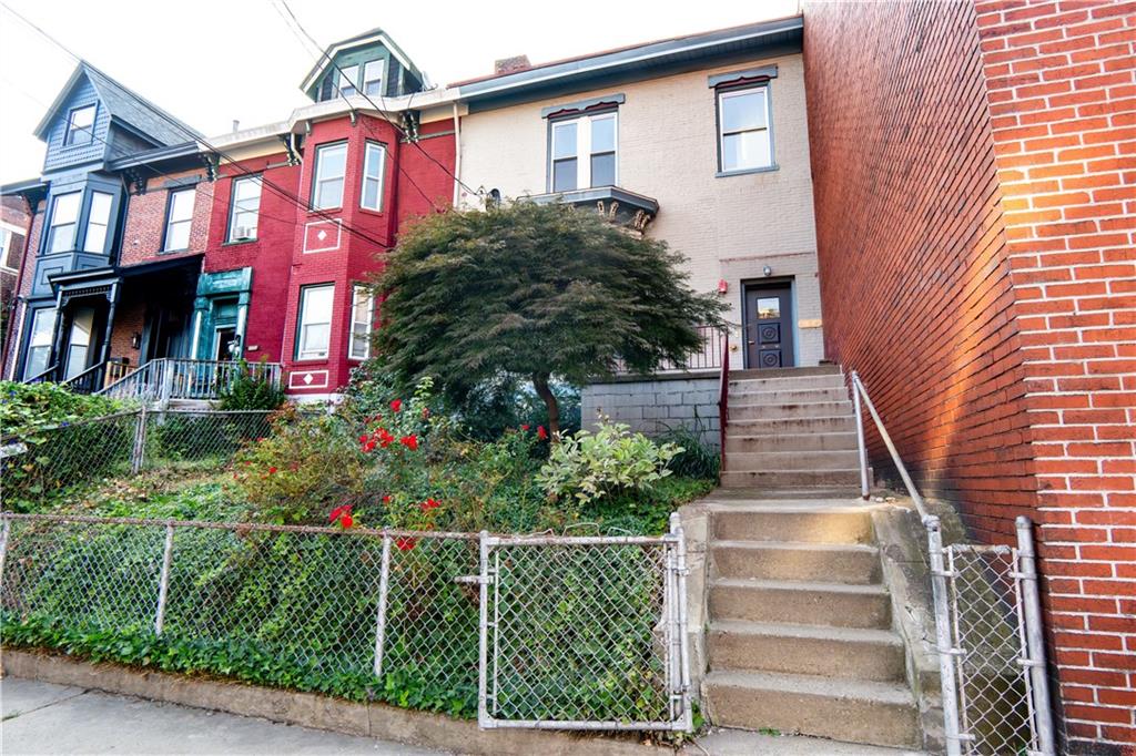 4402 Butler Street Pittsburgh, PA 15201 - Photo 28 of 28 a front view of a house with a garden