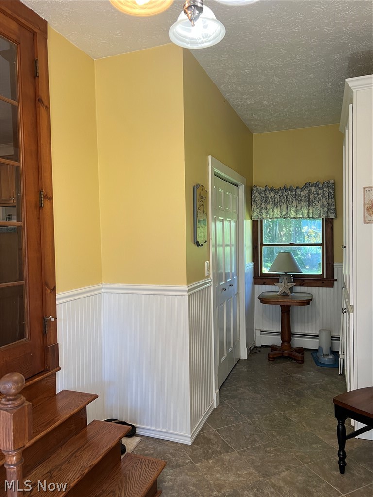 6119 Green Road Ashtabula, OH 44004 - Photo 25 of 35 19 x 8 mud room with closet, storage cabinets and bench.