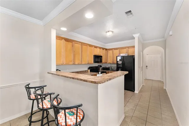 a kitchen that has a cabinets and a stove