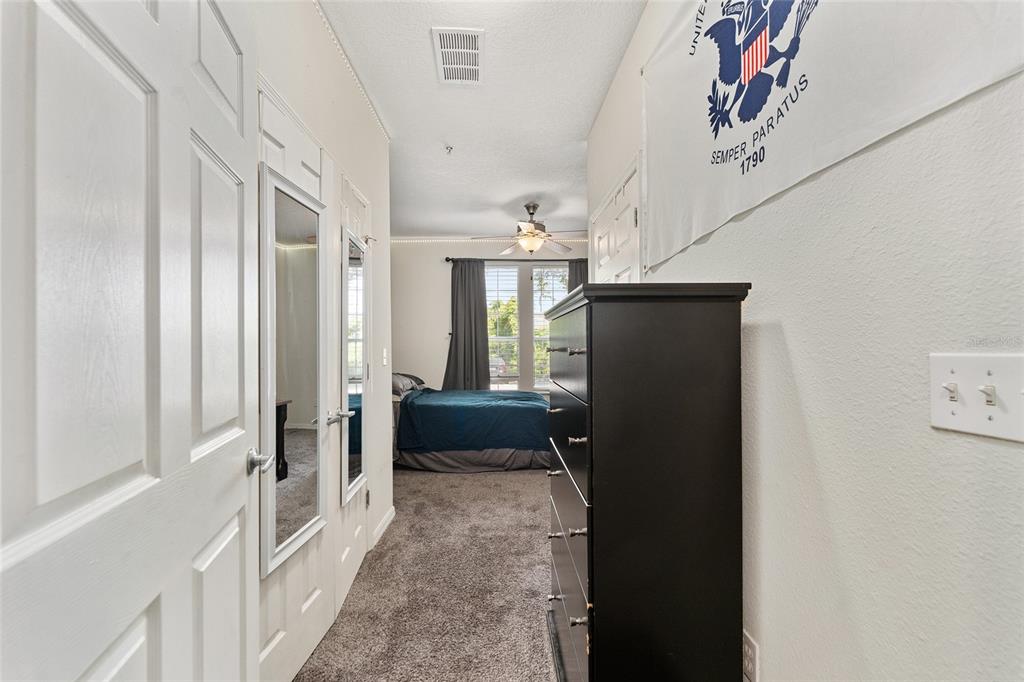 1142 Southwest 9th Road, Unit 103 Gainesville, FL 32601 - Photo 19 of 40 a view of a hallway with furniture and windows