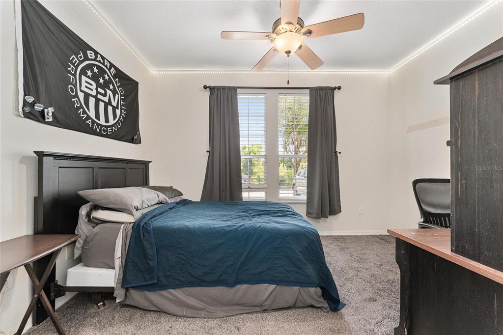 1142 Southwest 9th Road, Unit 103 Gainesville, FL 32601 - Photo 20 of 40 a bedroom with a bed and with window