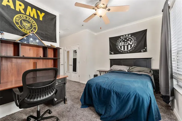 a bedroom with a bed and furniture