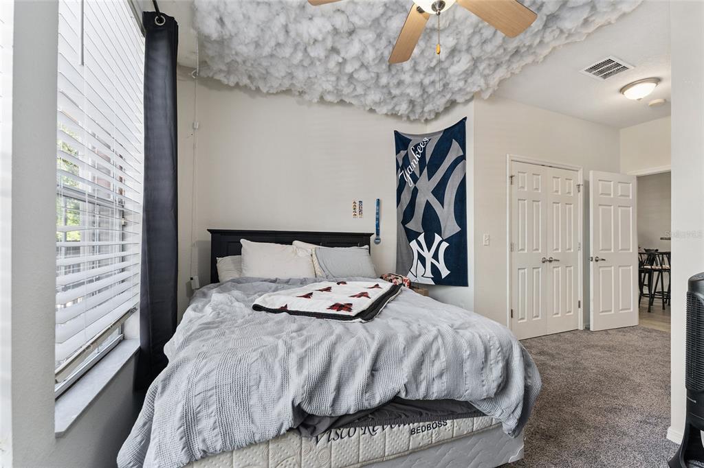 1142 Southwest 9th Road, Unit 103 Gainesville, FL 32601 - Photo 27 of 40 a bedroom with a bed and a window