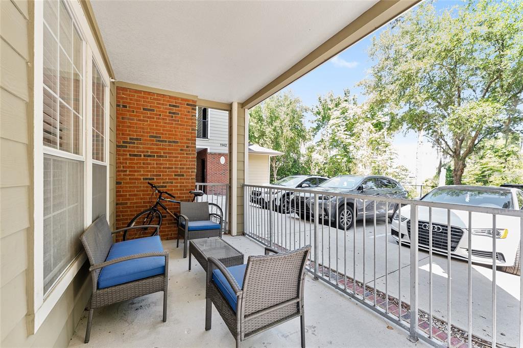 1142 Southwest 9th Road, Unit 103 Gainesville, FL 32601 - Photo 33 of 40 a view of a chairs and tables in the balcony