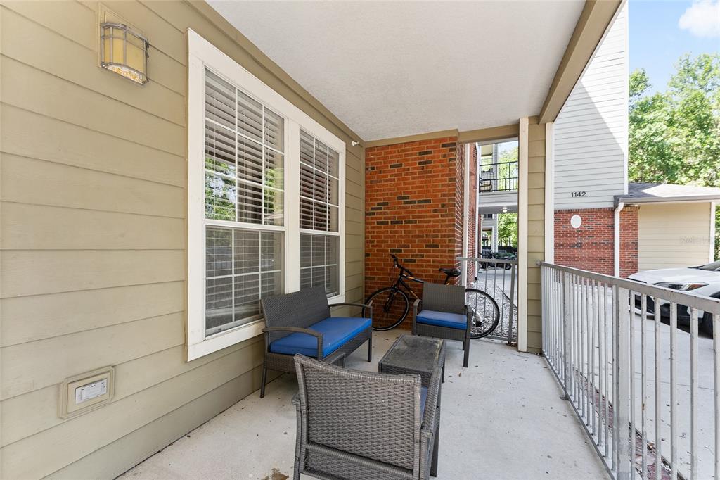 1142 Southwest 9th Road, Unit 103 Gainesville, FL 32601 - Photo 34 of 40 a building outdoor space with patio furniture