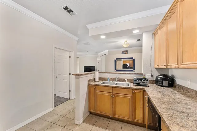 a kitchen with a stove a sink and a refrigerator