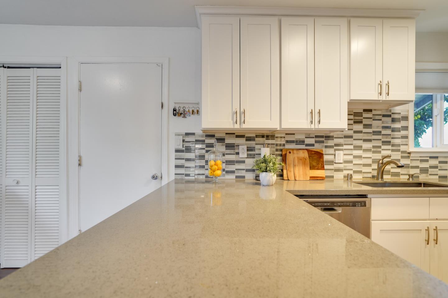3143 Kermath Drive San Jose, CA 95132 - Photo 11 of 62 a view of a kitchen with kitchen island a sink a counter top space and stainless steel appliances