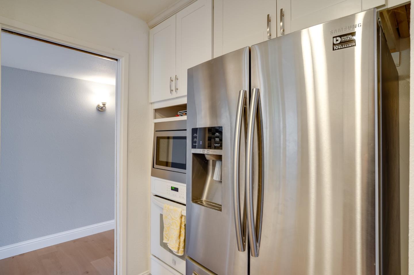 3143 Kermath Drive San Jose, CA 95132 - Photo 15 of 62 a metallic refrigerator freezer sitting inside of a kitchen