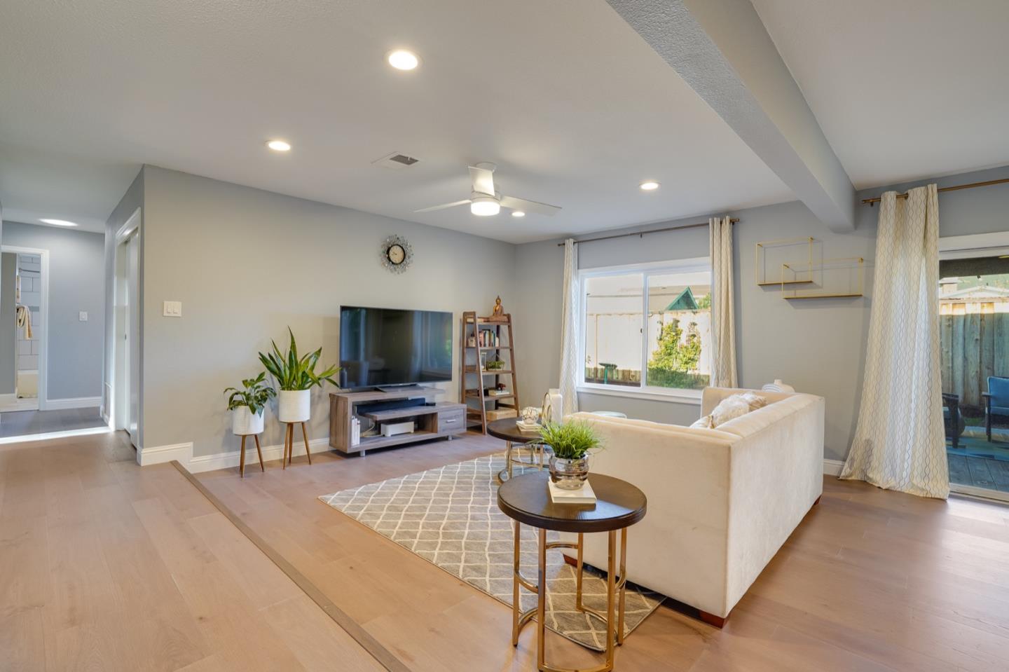 3143 Kermath Drive San Jose, CA 95132 - Photo 22 of 62 a living room with furniture and a flat screen tv