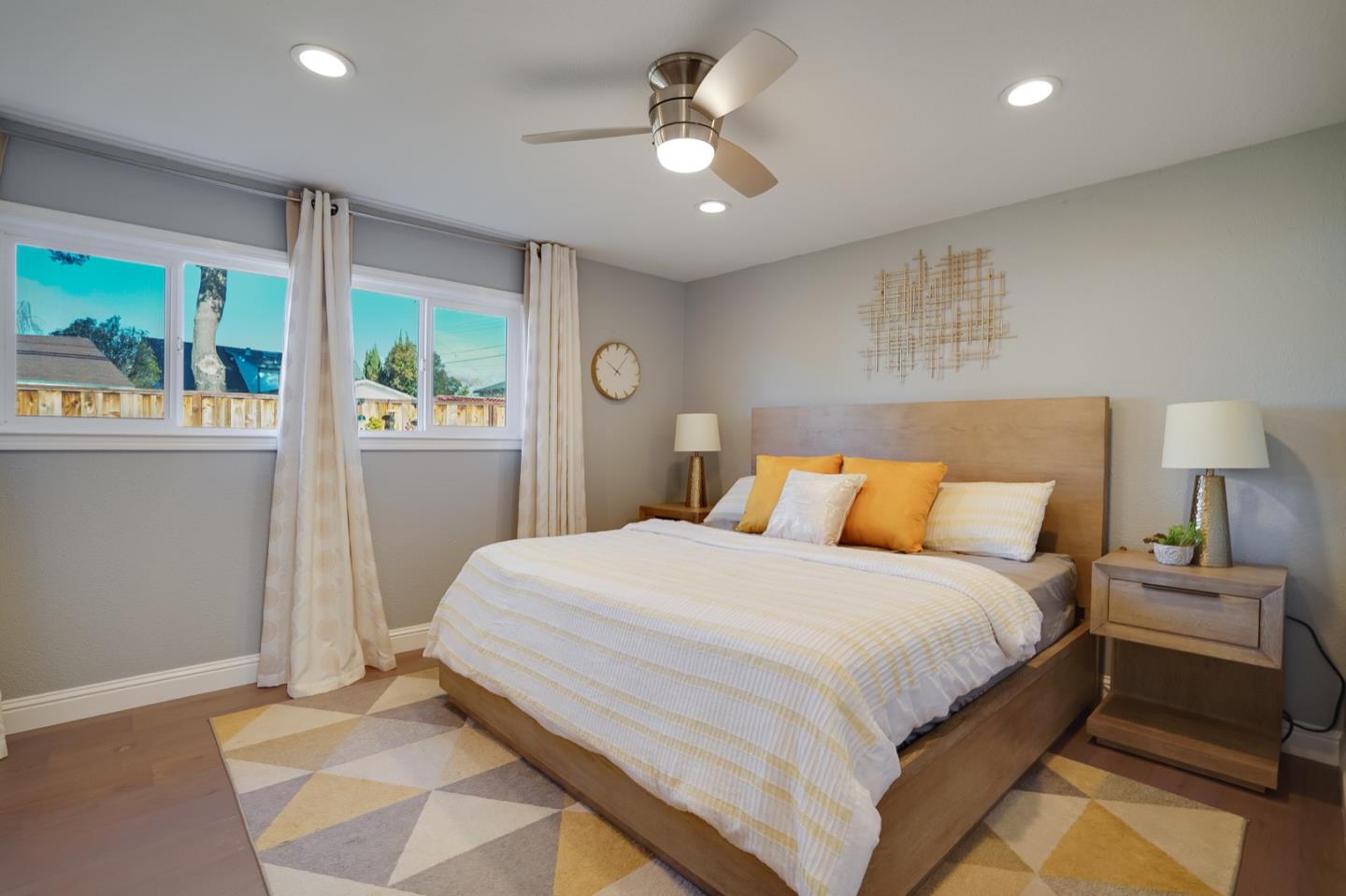 3143 Kermath Drive San Jose, CA 95132 - Photo 26 of 62 a bedroom with a large bed and a chandelier