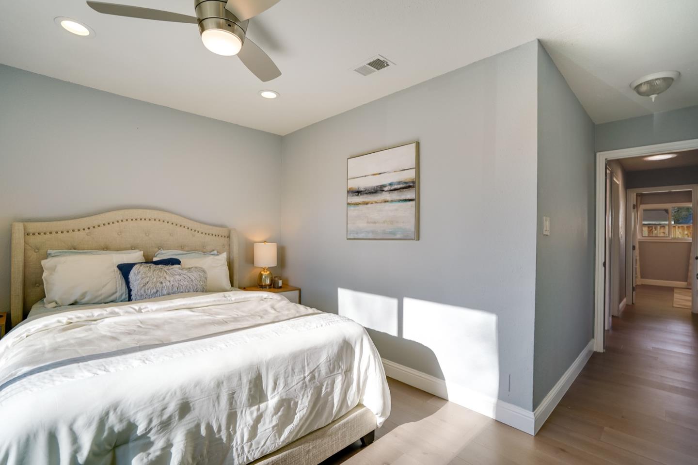 3143 Kermath Drive San Jose, CA 95132 - Photo 34 of 62 a bedroom with a bed and a chandelier