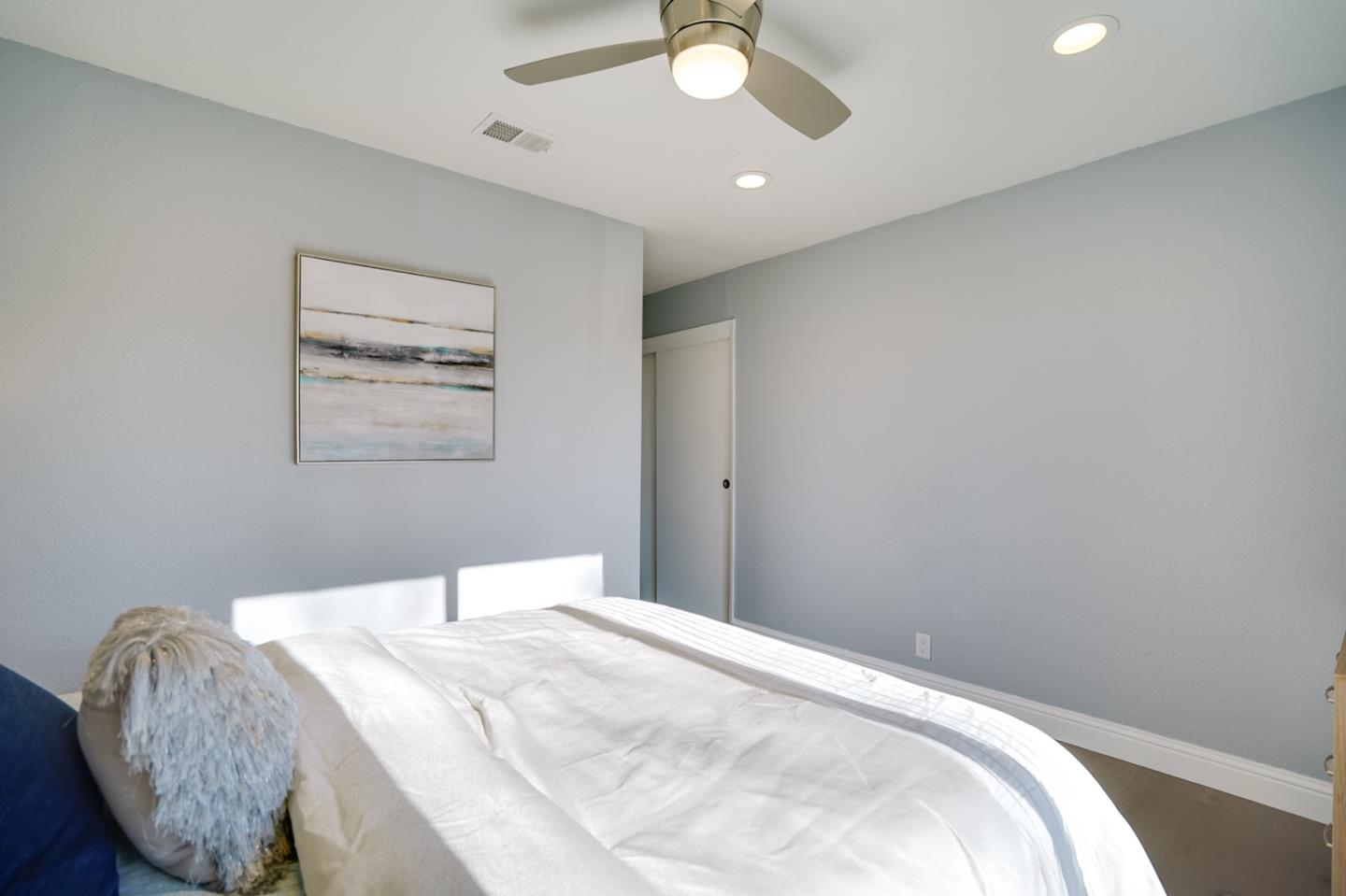 3143 Kermath Drive San Jose, CA 95132 - Photo 35 of 62 a bedroom with a bed and a chandelier