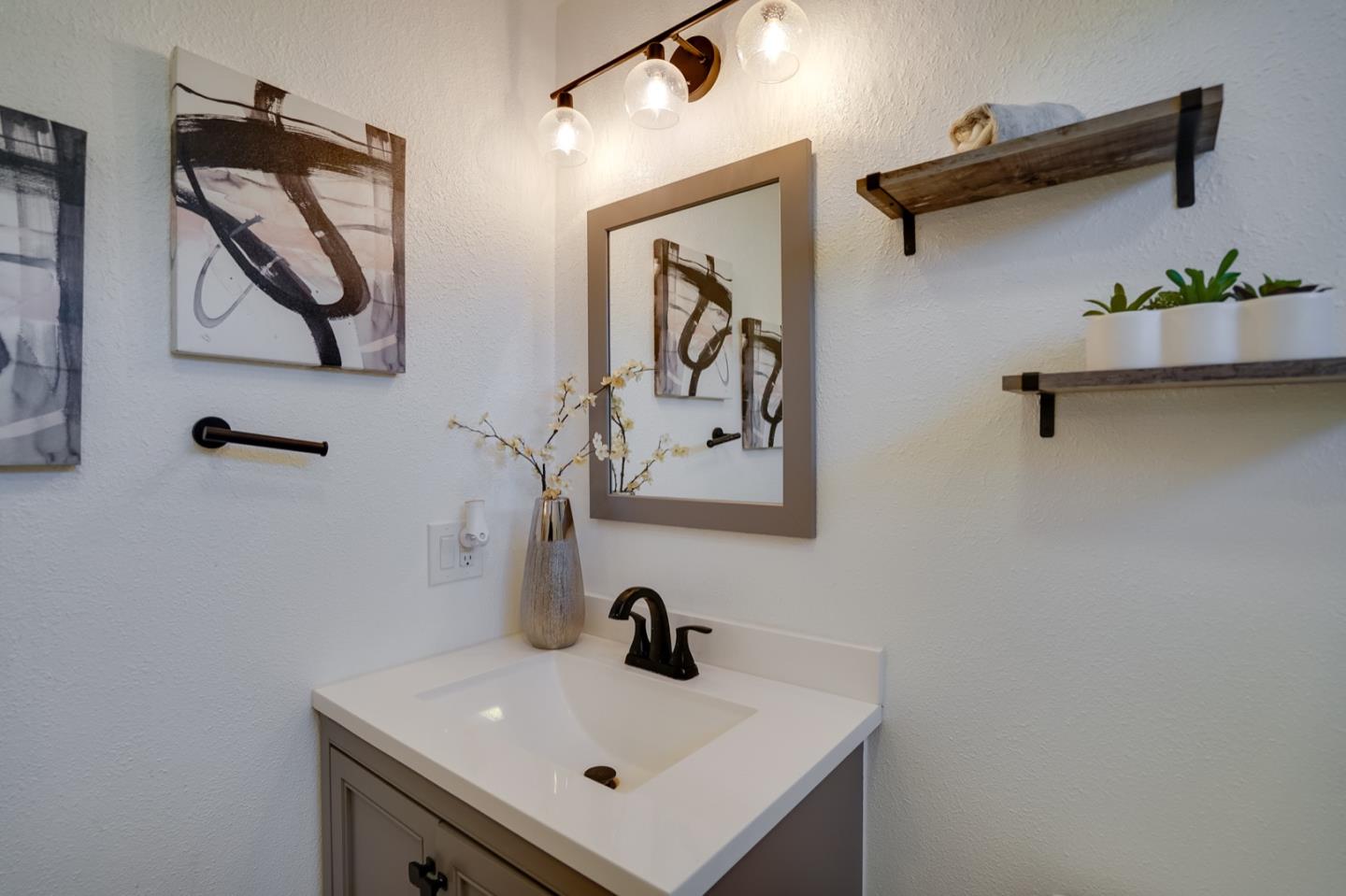 3143 Kermath Drive San Jose, CA 95132 - Photo 40 of 62 a bathroom with a sink and mirror