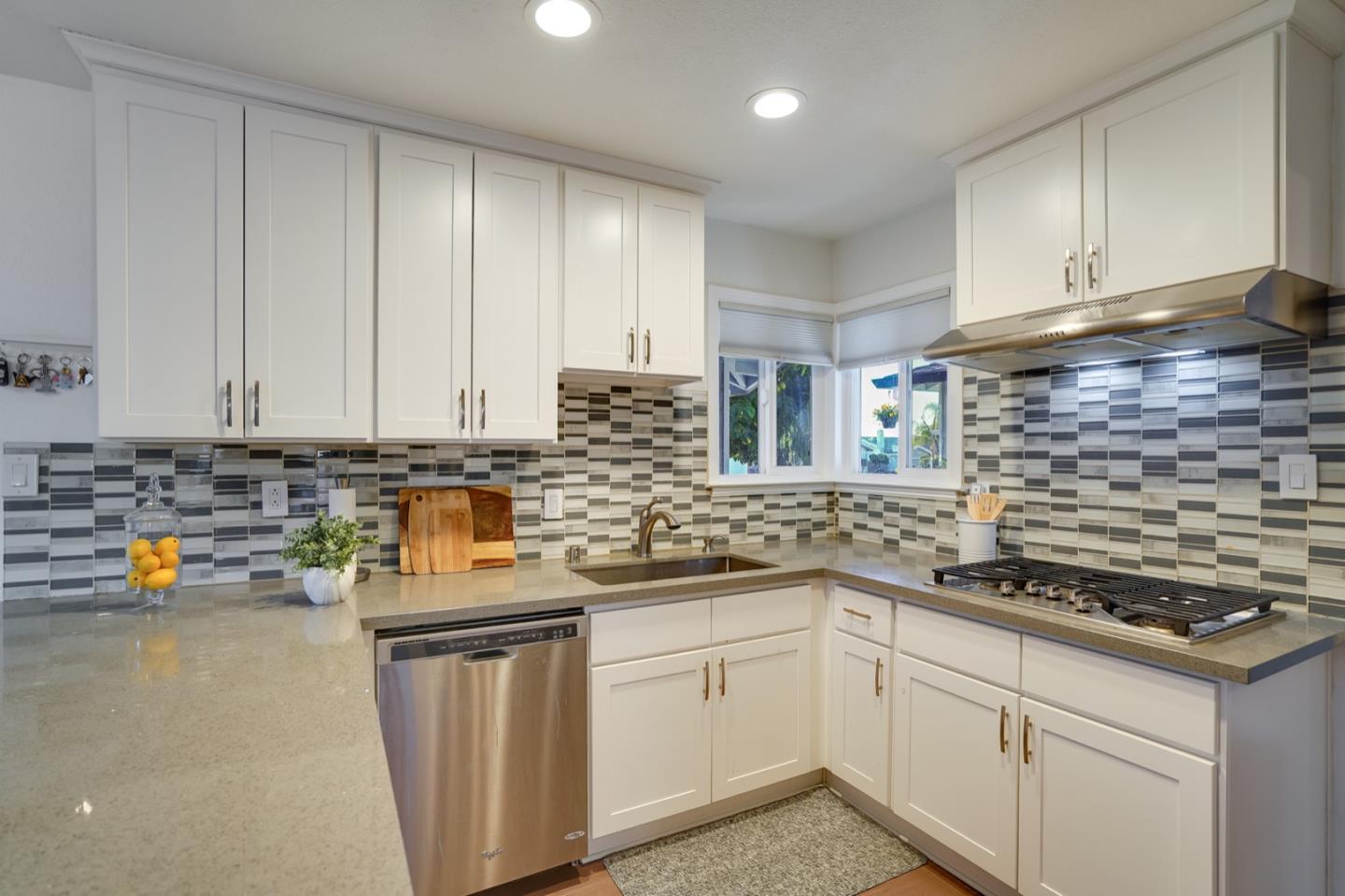 3143 Kermath Drive San Jose, CA 95132 - Photo 5 of 62 a kitchen with stainless steel appliances granite countertop a sink stove and cabinets