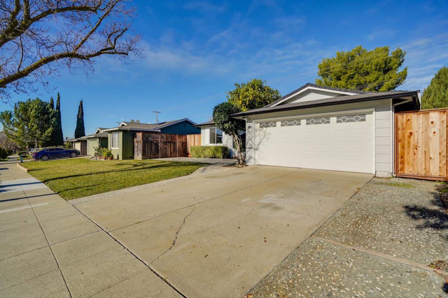 3143 Kermath Drive San Jose, CA 95132 - Photo 55 of 62 a front view of a house with a yard and garage