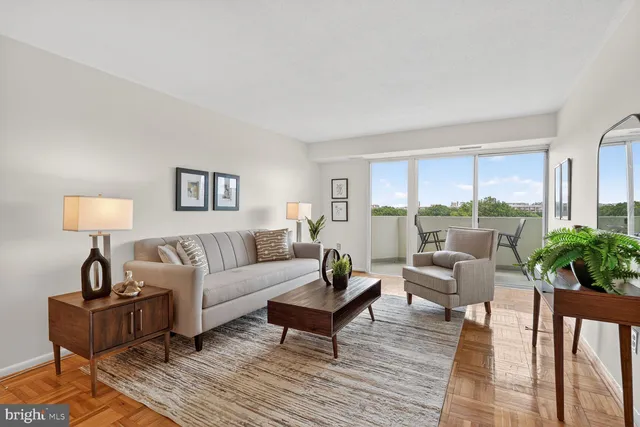 a living room with furniture and a lamp