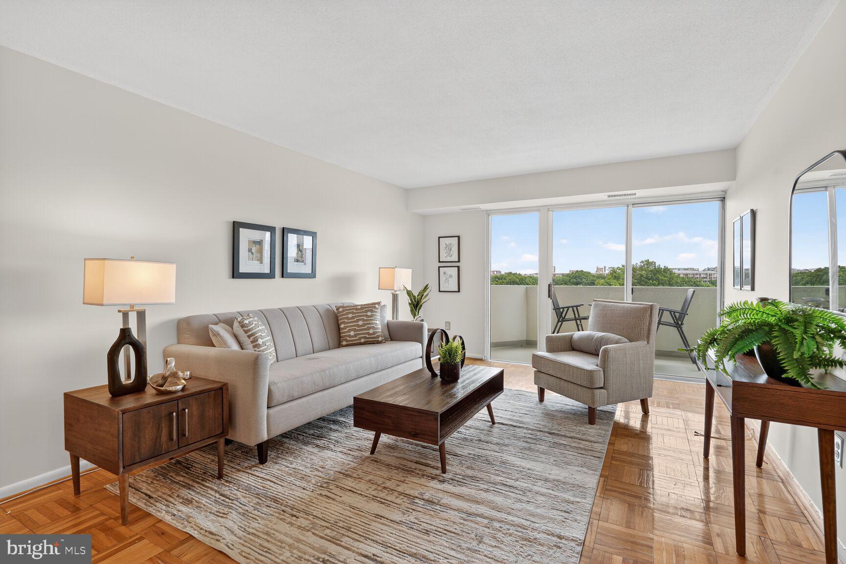 a living room with furniture and a lamp