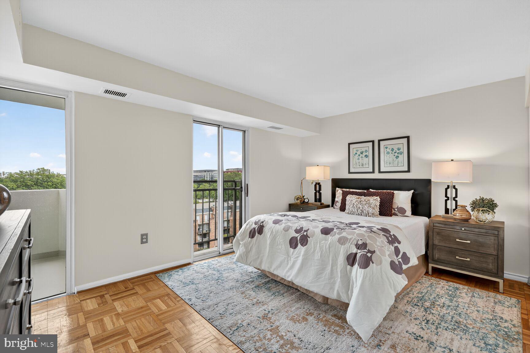 700 7th Street Southwest, Unit 716 Washington, DC 20024 - Photo 5 of 23 a bedroom with a bed and a window