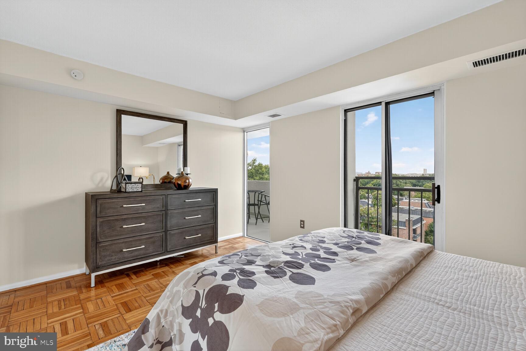 700 7th Street Southwest, Unit 716 Washington, DC 20024 - Photo 7 of 23 a bedroom with a bed and a window