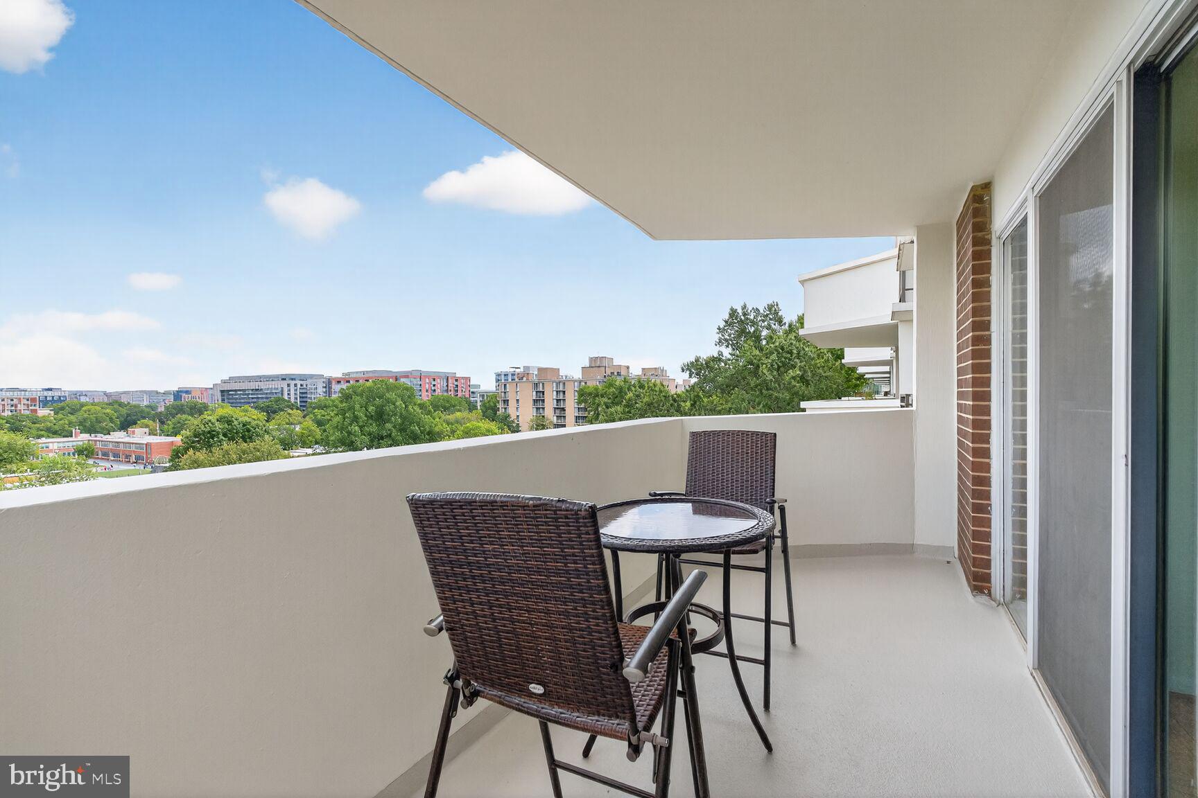 700 7th Street Southwest, Unit 716 Washington, DC 20024 - Photo 8 of 23 a balcony with table and chairs