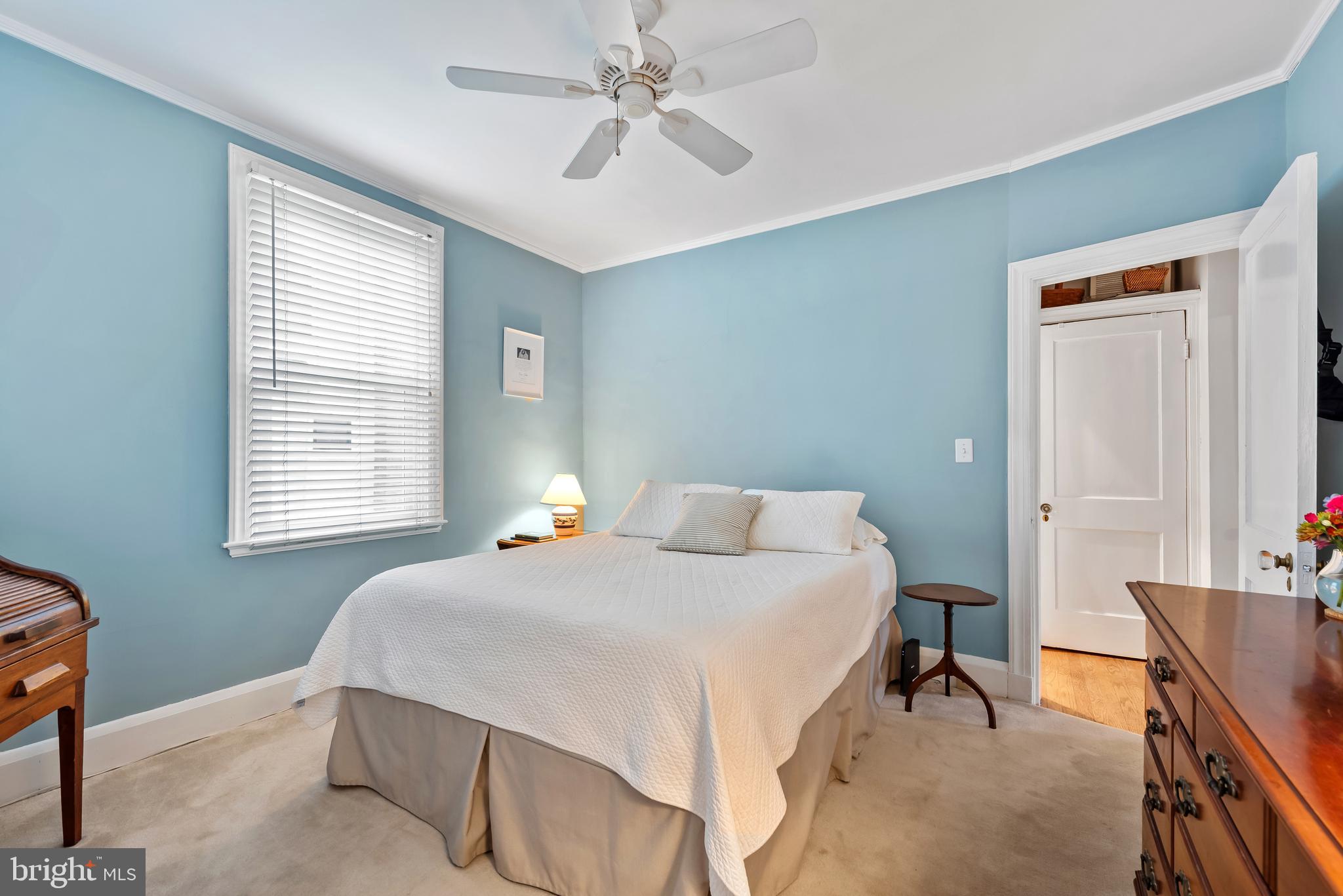 706 Murdock Road Baltimore, MD 21212 - Photo 17 of 39 a bedroom with a bed and a chandelier