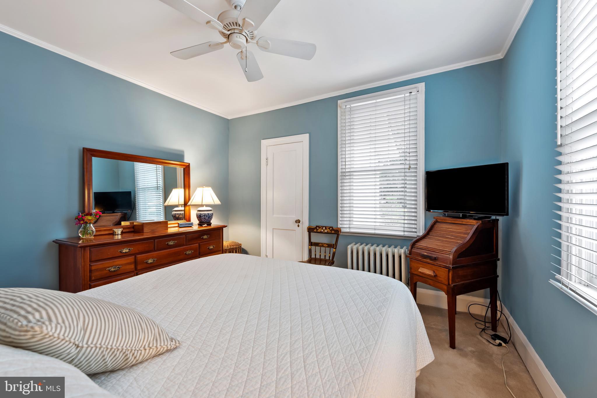 706 Murdock Road Baltimore, MD 21212 - Photo 18 of 39 a bedroom with a bed and a flat screen tv