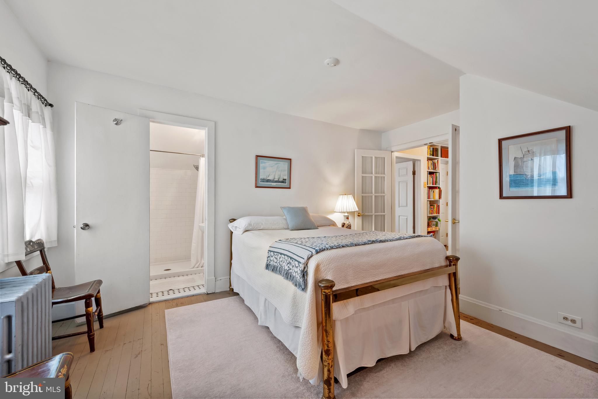 706 Murdock Road Baltimore, MD 21212 - Photo 21 of 39 a bed room with a bed and a chair