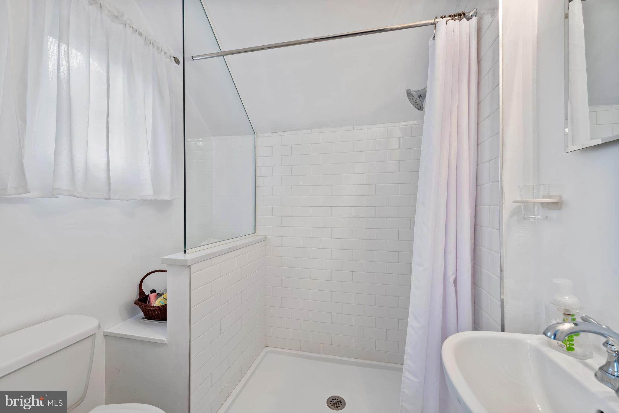 706 Murdock Road Baltimore, MD 21212 - Photo 23 of 39 a bathroom with a shower and bathtub