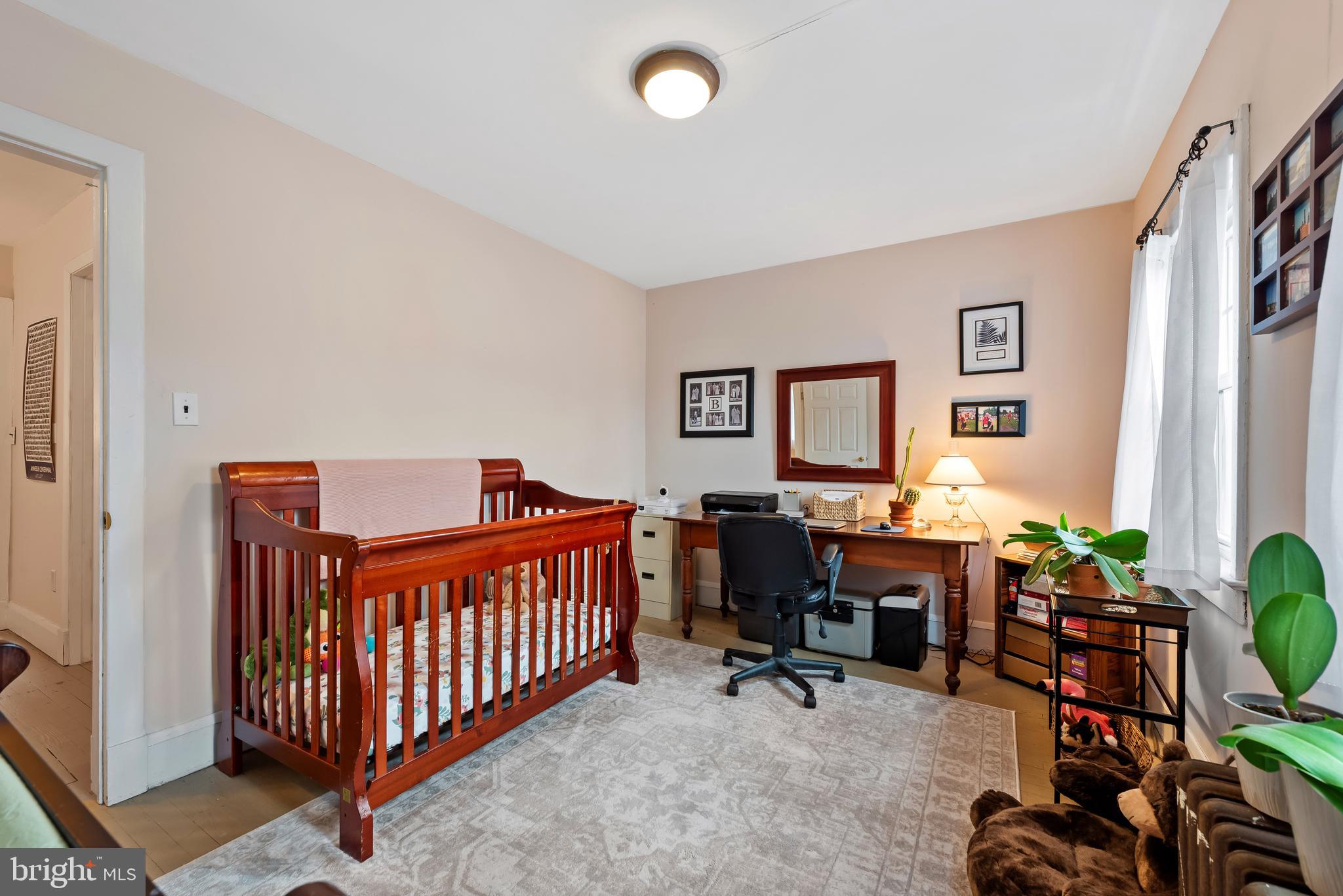 706 Murdock Road Baltimore, MD 21212 - Photo 24 of 39 a bedroom with furniture and a window