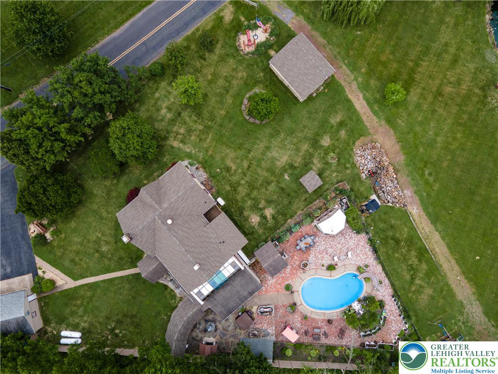 2485 Hieter Road Quakertown, PA 18951 - Photo 89 of 97 An aerial perspective reveals a private yard with a kidney-shaped pool and ample green space.