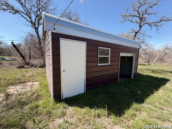 a view of a backyard of the house