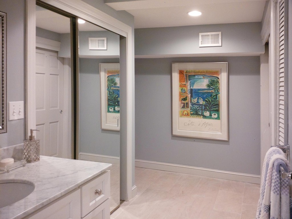 107 Arnold Road Newton, MA 02459 - Photo 13 of 18 a bathroom with a granite countertop sink a vanity and a window