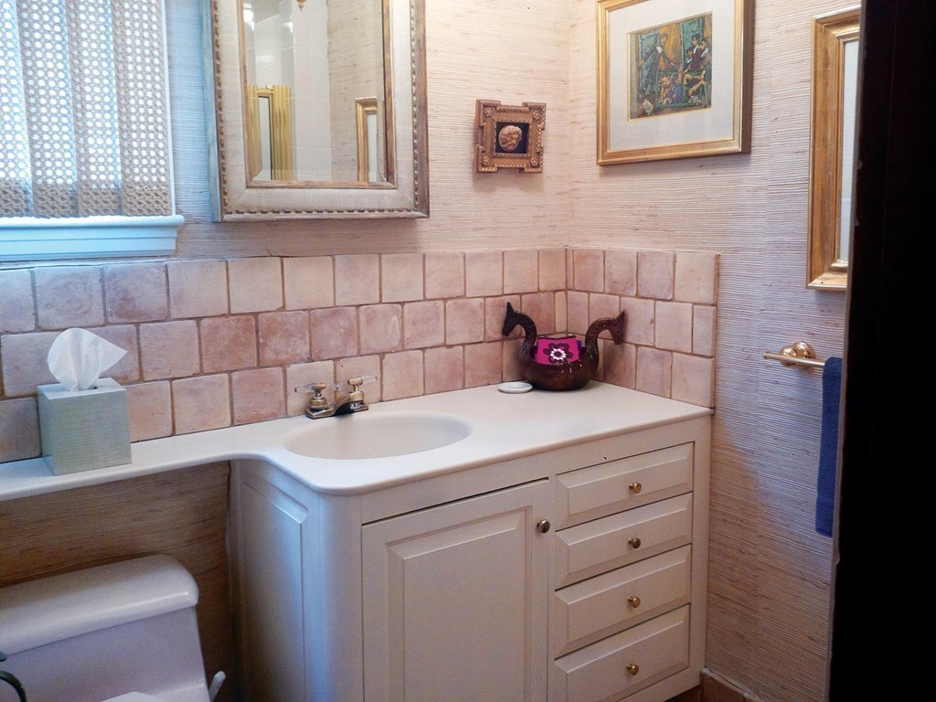 107 Arnold Road Newton, MA 02459 - Photo 8 of 18 a bathroom with a sink and cabinets
