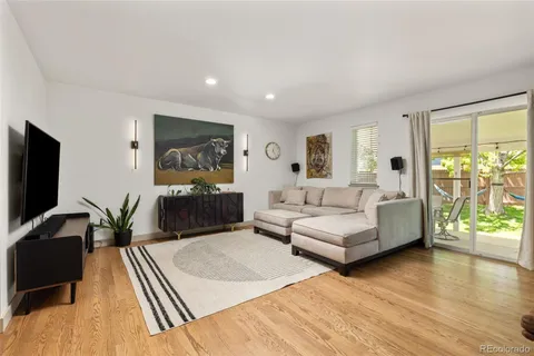 a bedroom with a bed and large window