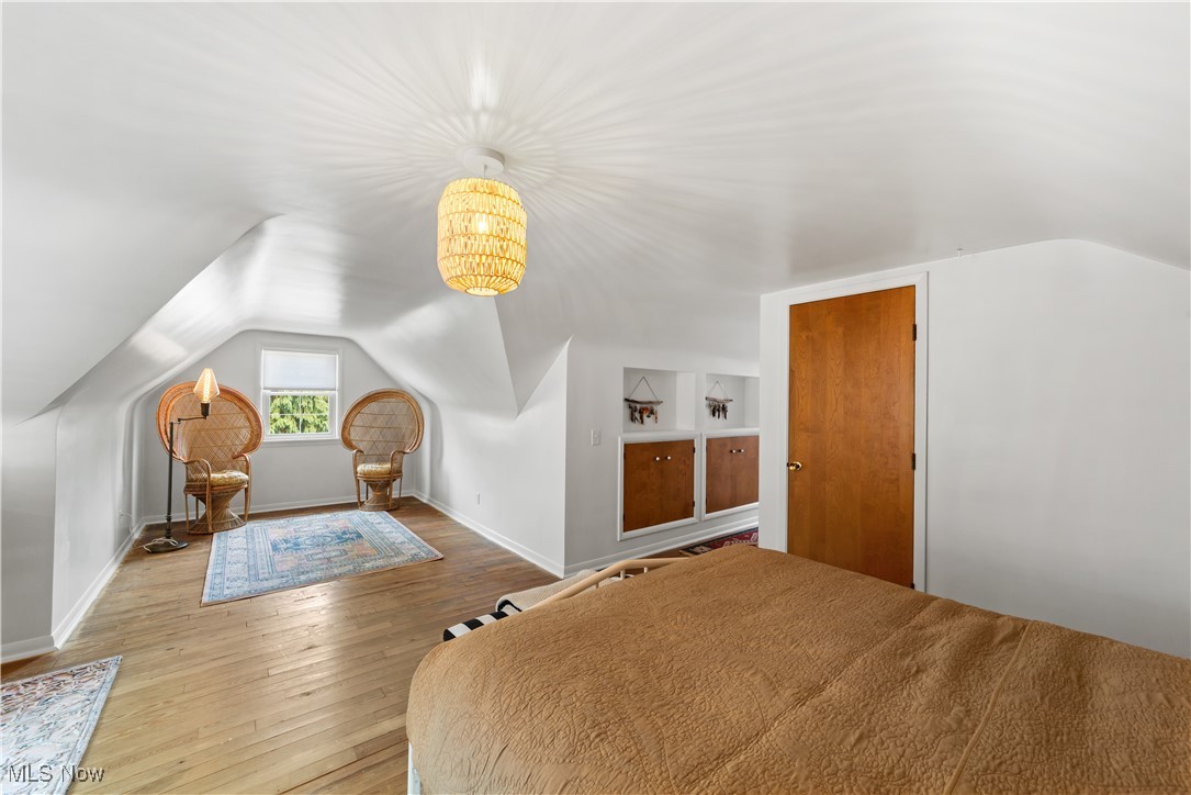 4648 Ammon Road Cleveland, OH 44143 - Photo 27 of 48 Bedroom featuring a notable light, wood flooring,