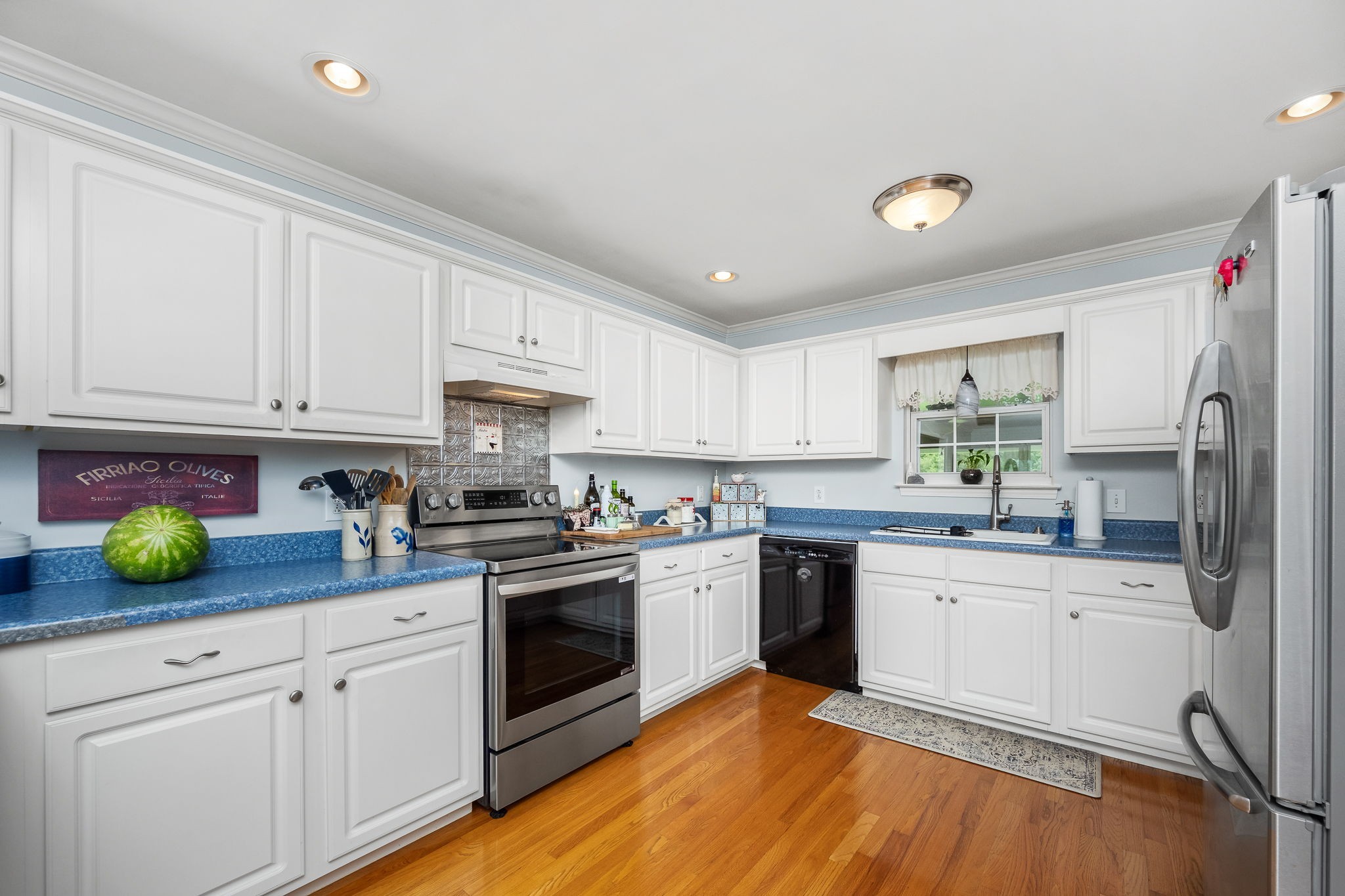 4330 River Lane Milton, TN 37118 - Photo 15 of 44 a kitchen with a sink a stove and cabinets