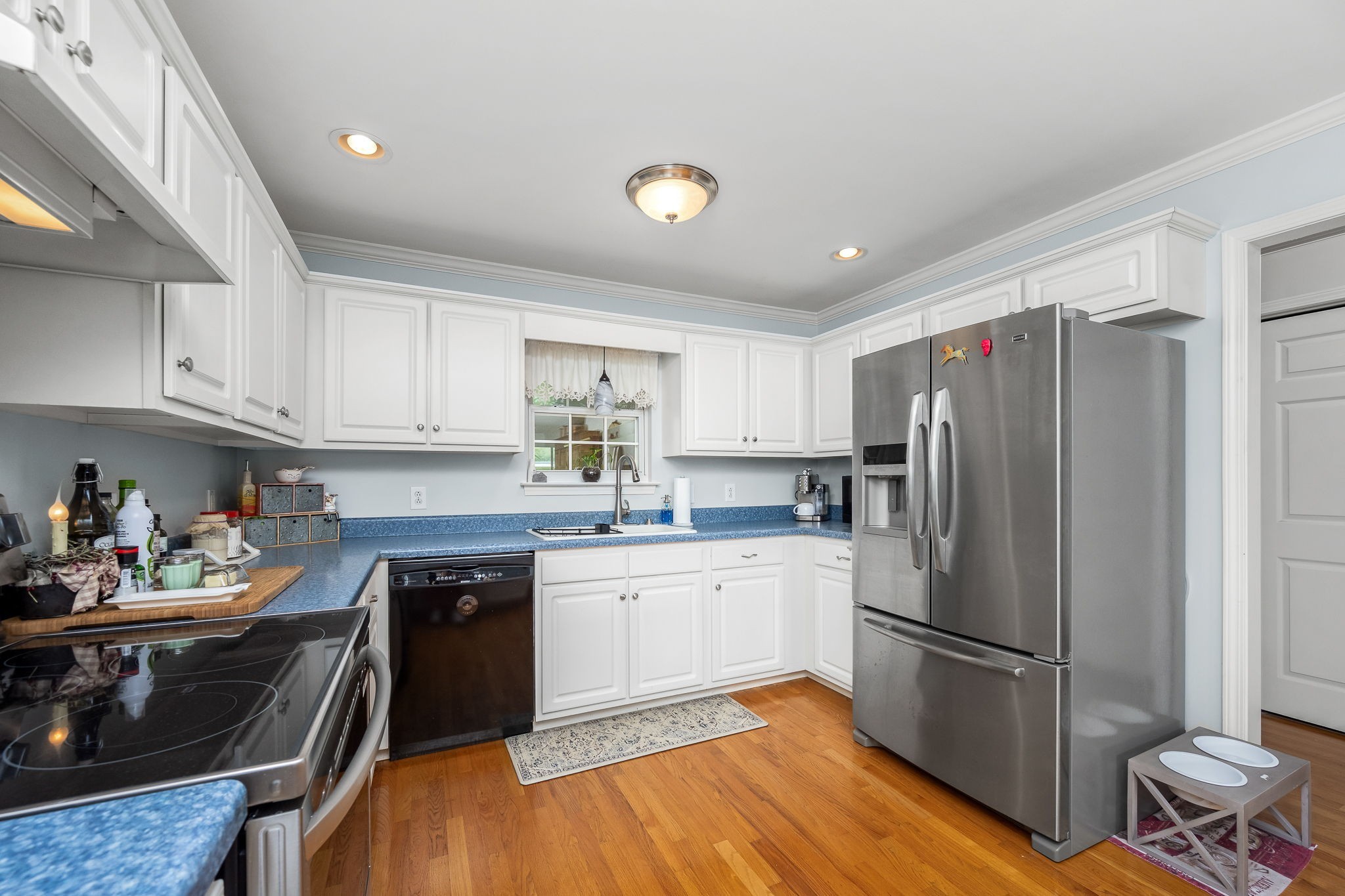 4330 River Lane Milton, TN 37118 - Photo 16 of 44 a kitchen with a refrigerator and white cabinets