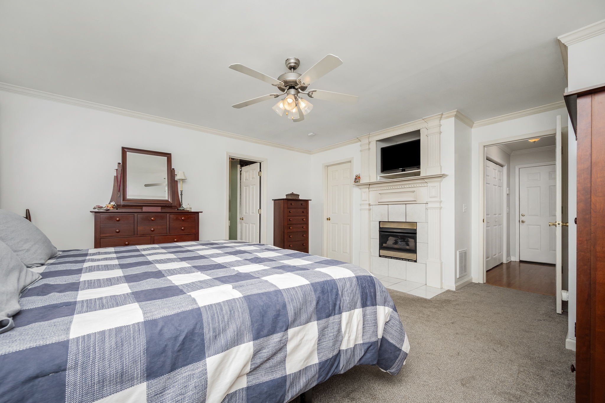 4330 River Lane Milton, TN 37118 - Photo 20 of 44 a bedroom with a large bed and a fireplace