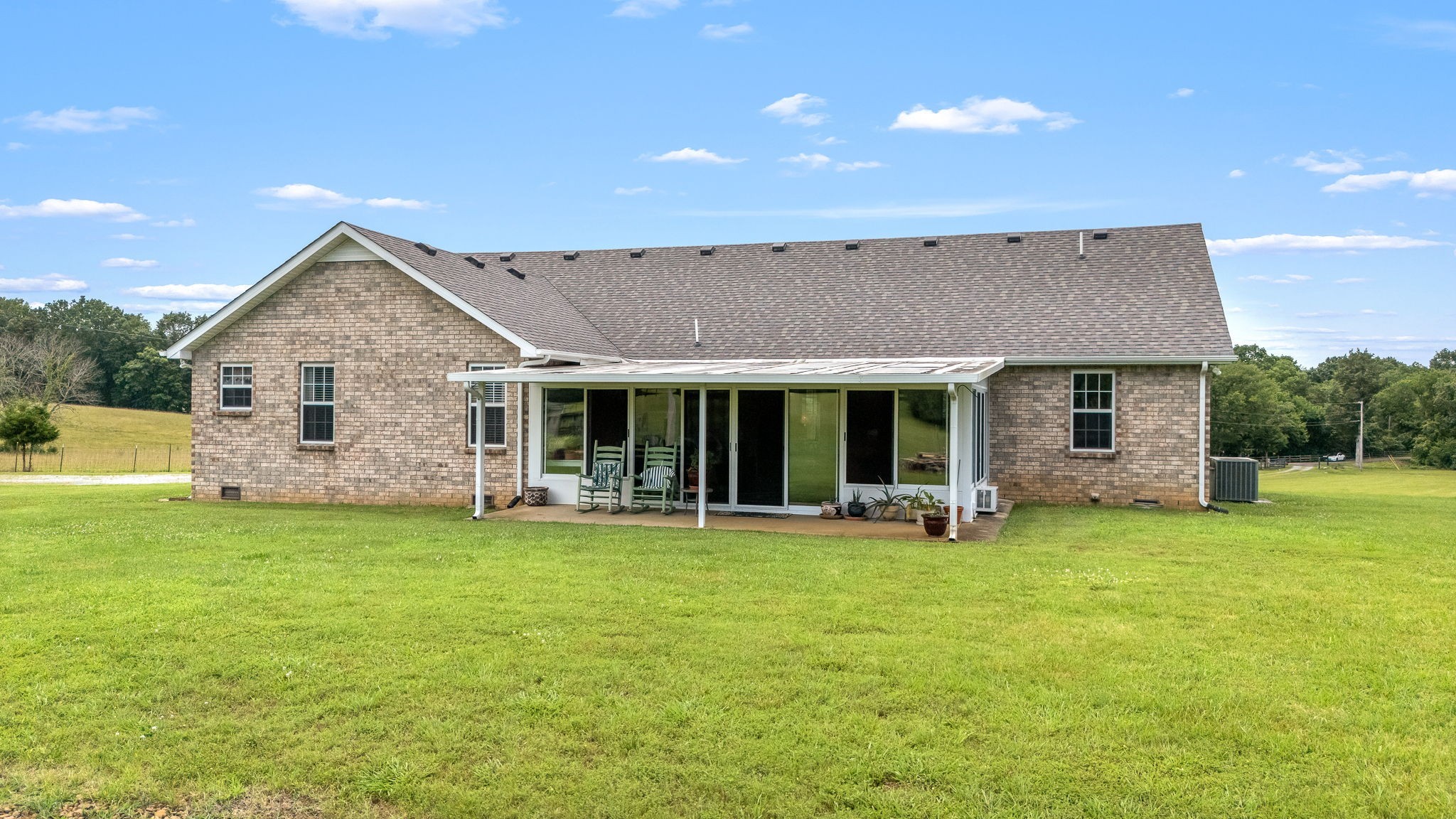 4330 River Lane Milton, TN 37118 - Photo 31 of 44 a front view of a house with a garden and porch