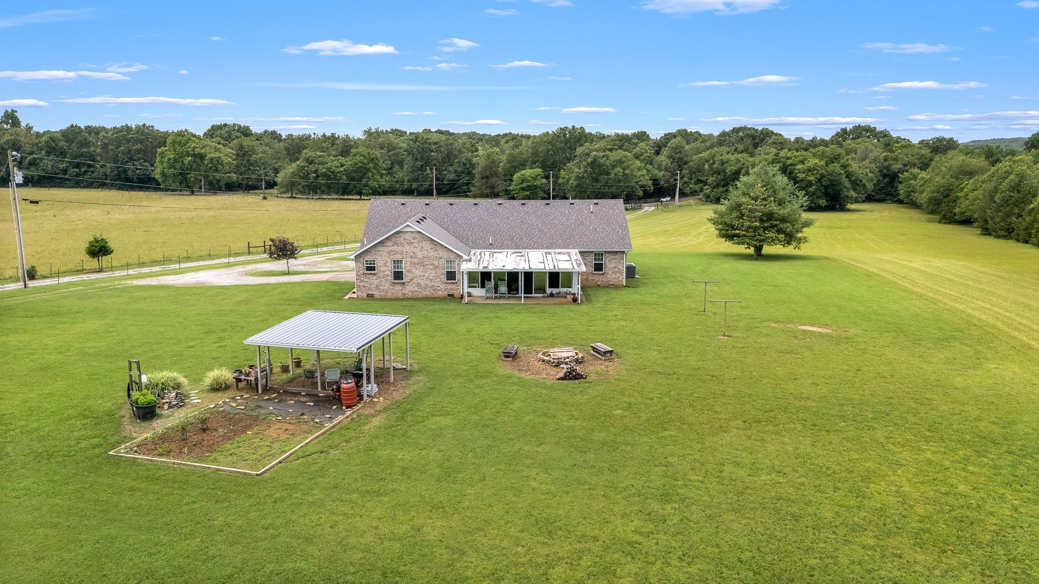 4330 River Lane Milton, TN 37118 - Photo 5 of 44 a view of a lake with lawn chairs under an umbrella