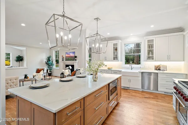 a kitchen with stainless steel appliances granite countertop a stove and a refrigerator