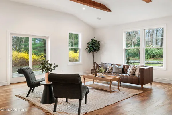 a bathroom with a granite countertop toilet sink and mirror