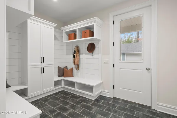 a spacious bedroom with a bed and a couch