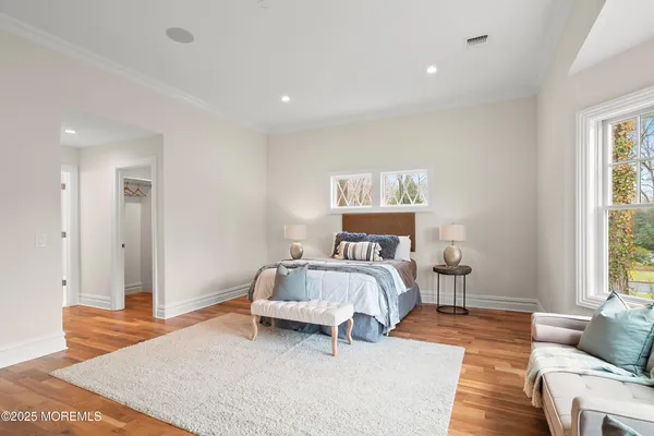 a bathroom with a granite countertop toilet a sink and a mirror