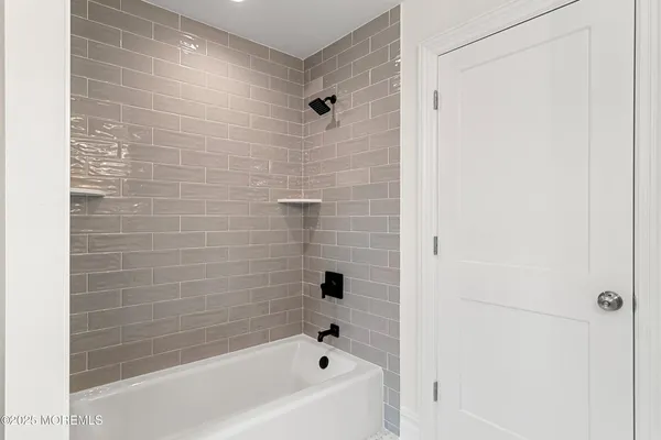 an empty room with wooden floor and a window